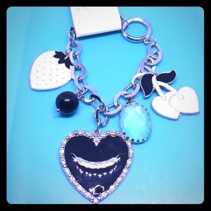Silvertone charm bracelet black and cream